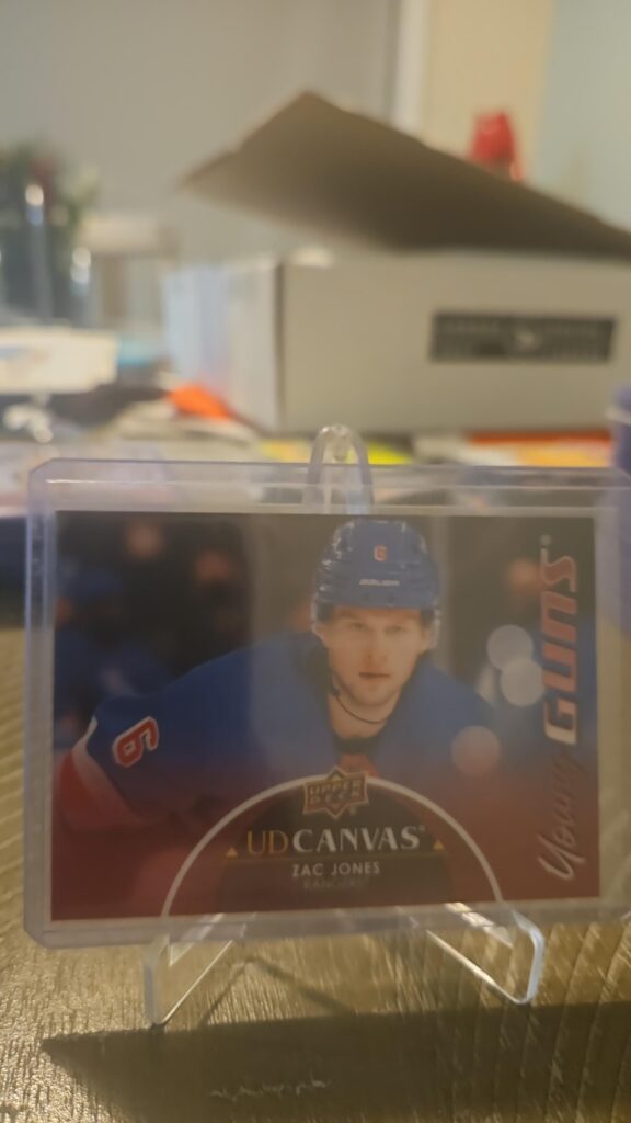 Zac Jones 2021-22 Upper Deck Series 2 Young Guns Canvas #C92 rookie card, a prized collectible for New York Rangers fans.