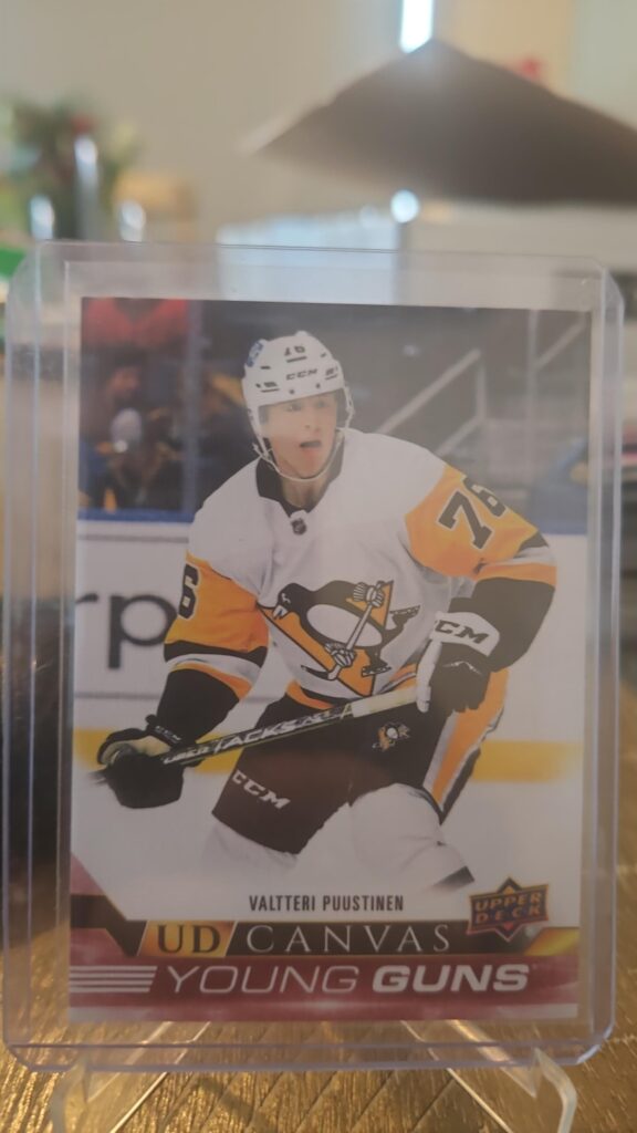 Valtteri Puustinen 2022-23 Upper Deck Series 2 Young Guns Canvas #C108 rookie card, a prized collectible for Pittsburgh Penguins fans.
