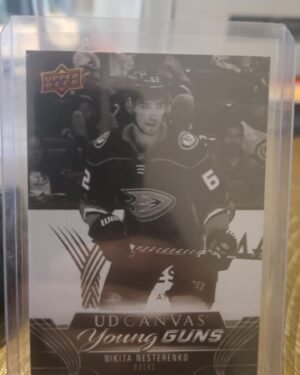 High-quality image of the 2023-24 Upper Deck Nikita Nesterenko Young Guns Rookie Canvas Black and White NHL hockey card, a short-print rookie parallel popular with prospect and Young Guns collectors.