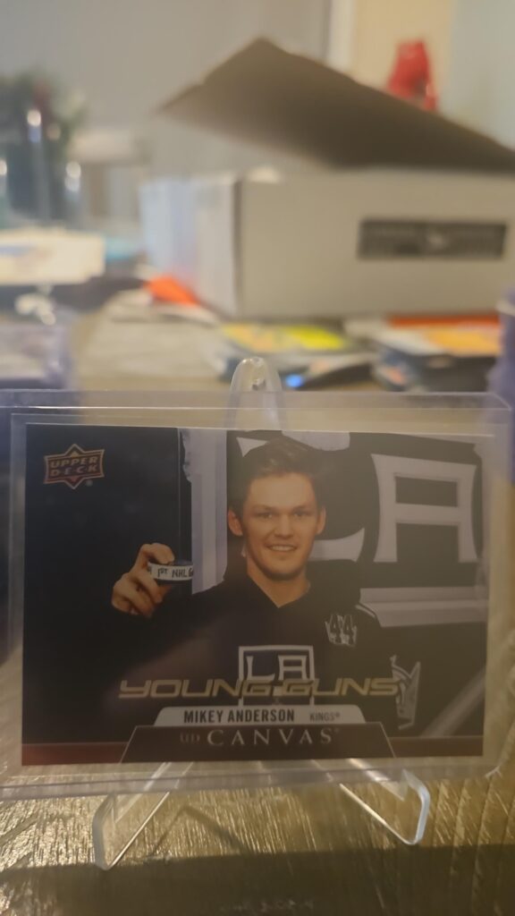Mikey Anderson 2020-21 Upper Deck Series 2 Young Guns Canvas #C117 rookie card, a prized collectible for Los Angeles Kings fans.