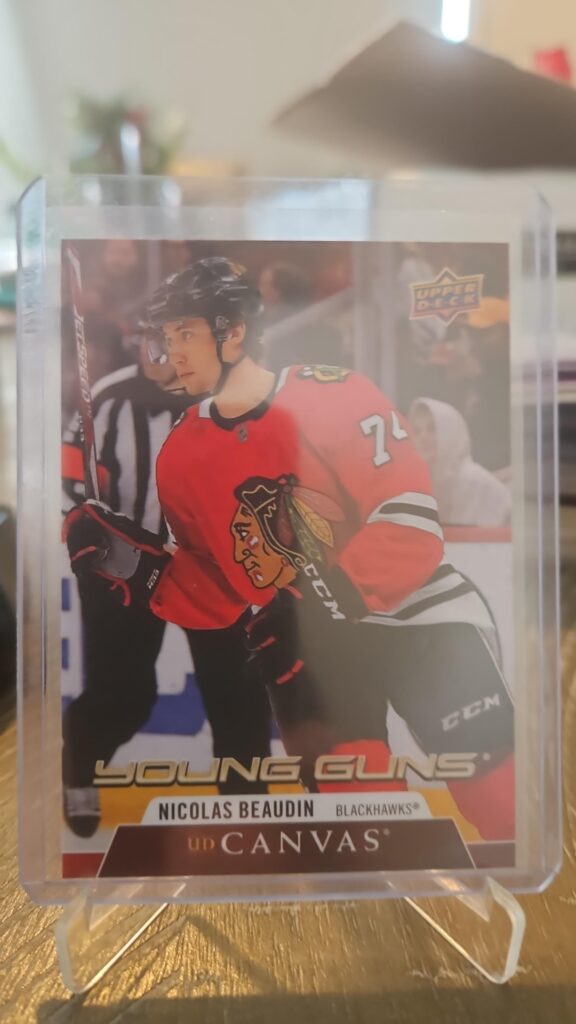 Nicolas Beaudin 2020-21 Upper Deck Series 2 Young Guns Canvas #C99 rookie card, a prized collectible for Chicago Blackhawks fans.