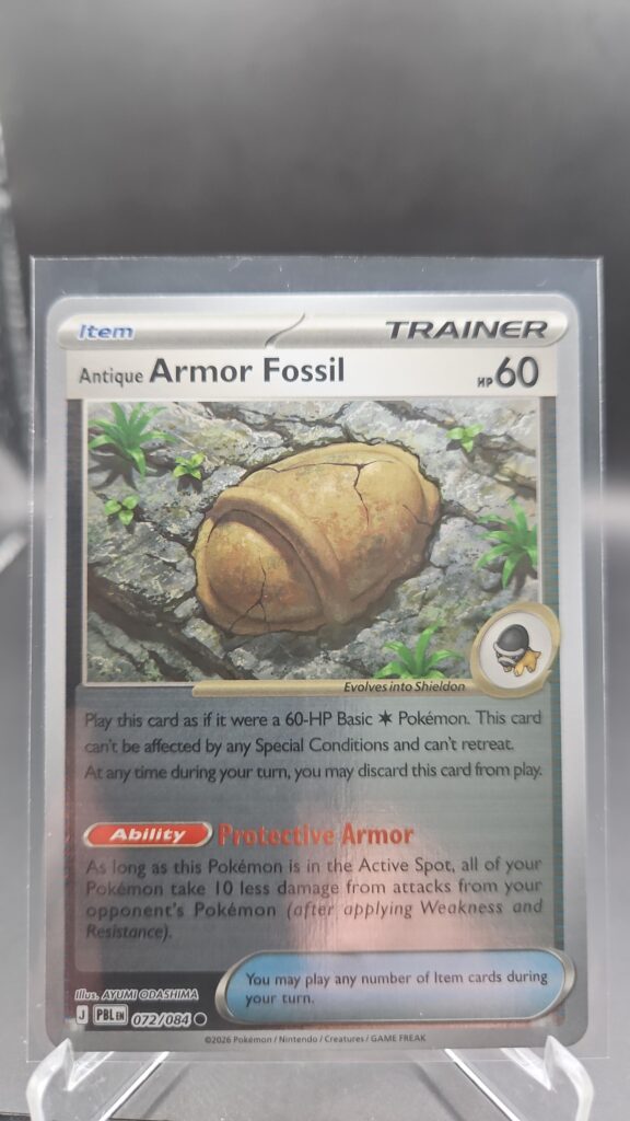 Antique Armor Fossil 072/084 Reverse Holo Pokémon card from Pitch Black ME05 in Near Mint condition.