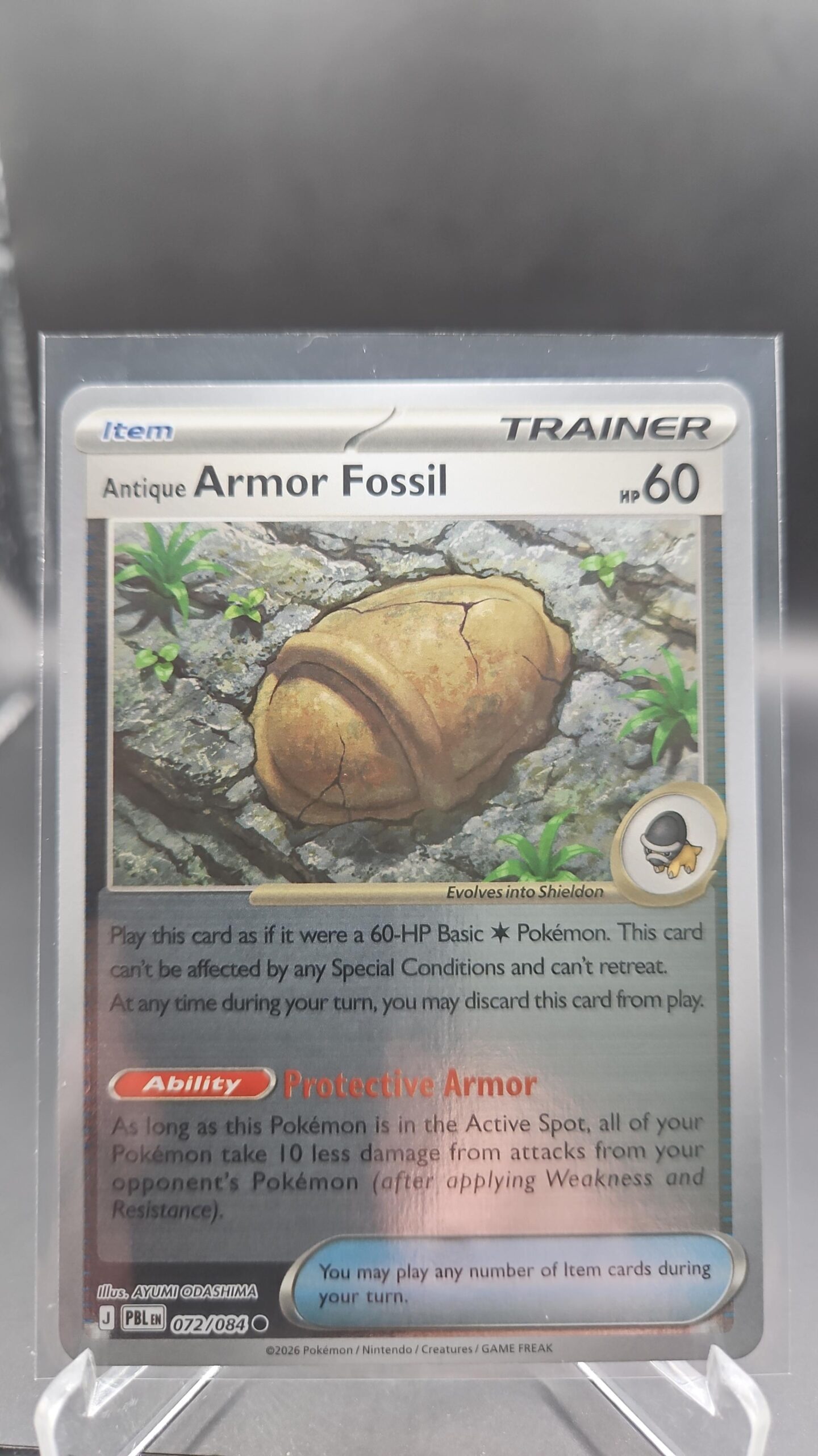 Antique Armor Fossil 072/084 Reverse Holo Pokémon card from Pitch Black ME05 in Near Mint condition.