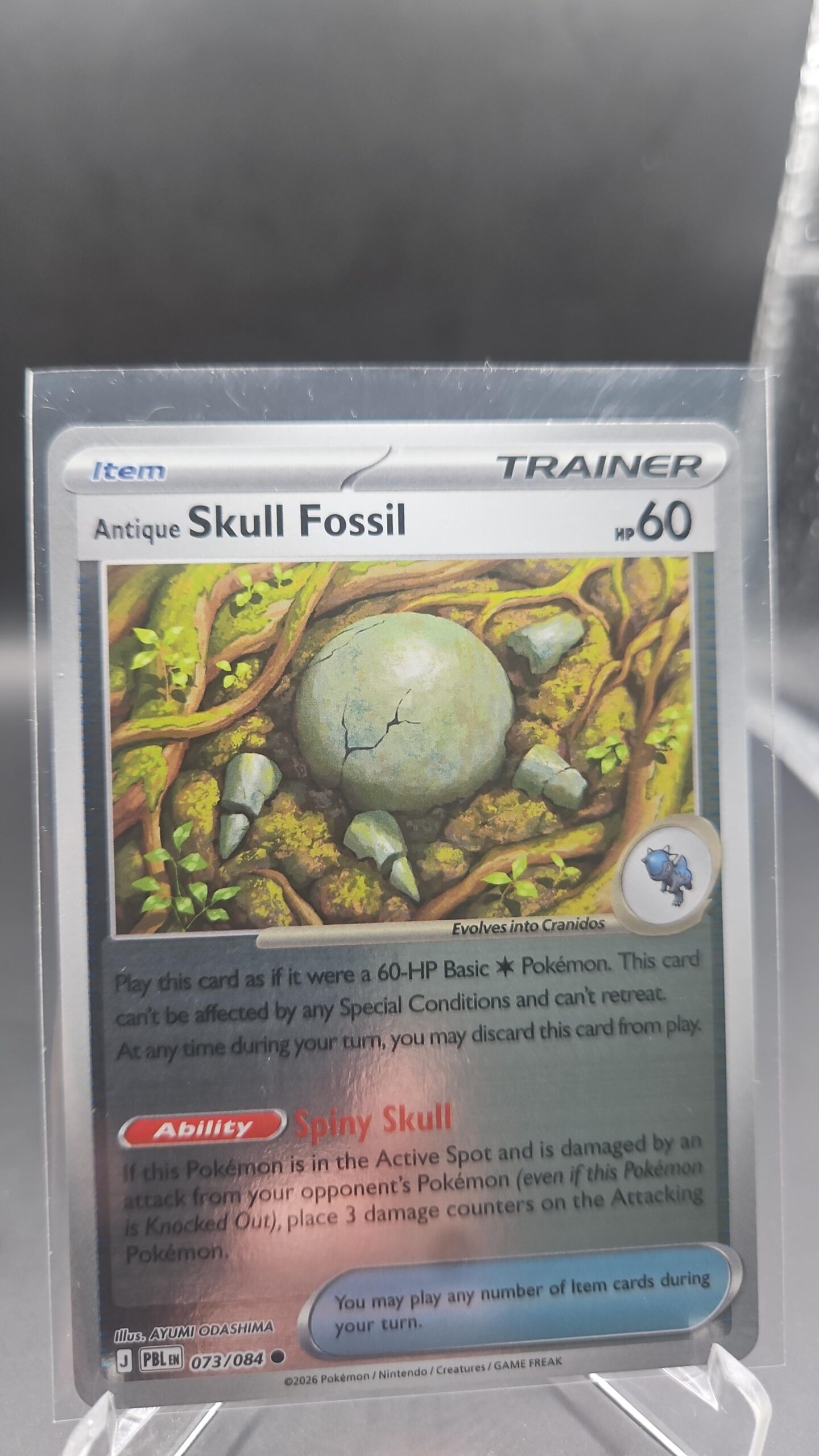Antique Skull Fossil 073/084 Reverse Holo Pokémon card from the Mega Evolution Era Pitch Black ME05 set in Near Mint condition.