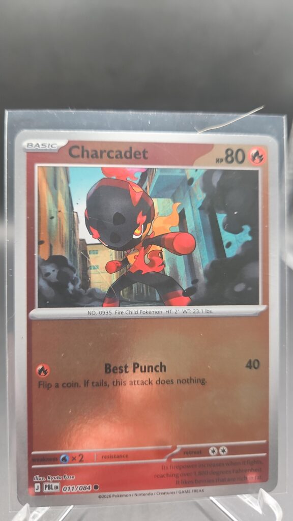 Charcadet 011/084 Reverse Holo Pokémon card from the Mega Evolution Era Pitch Black ME05 set in Near Mint condition.