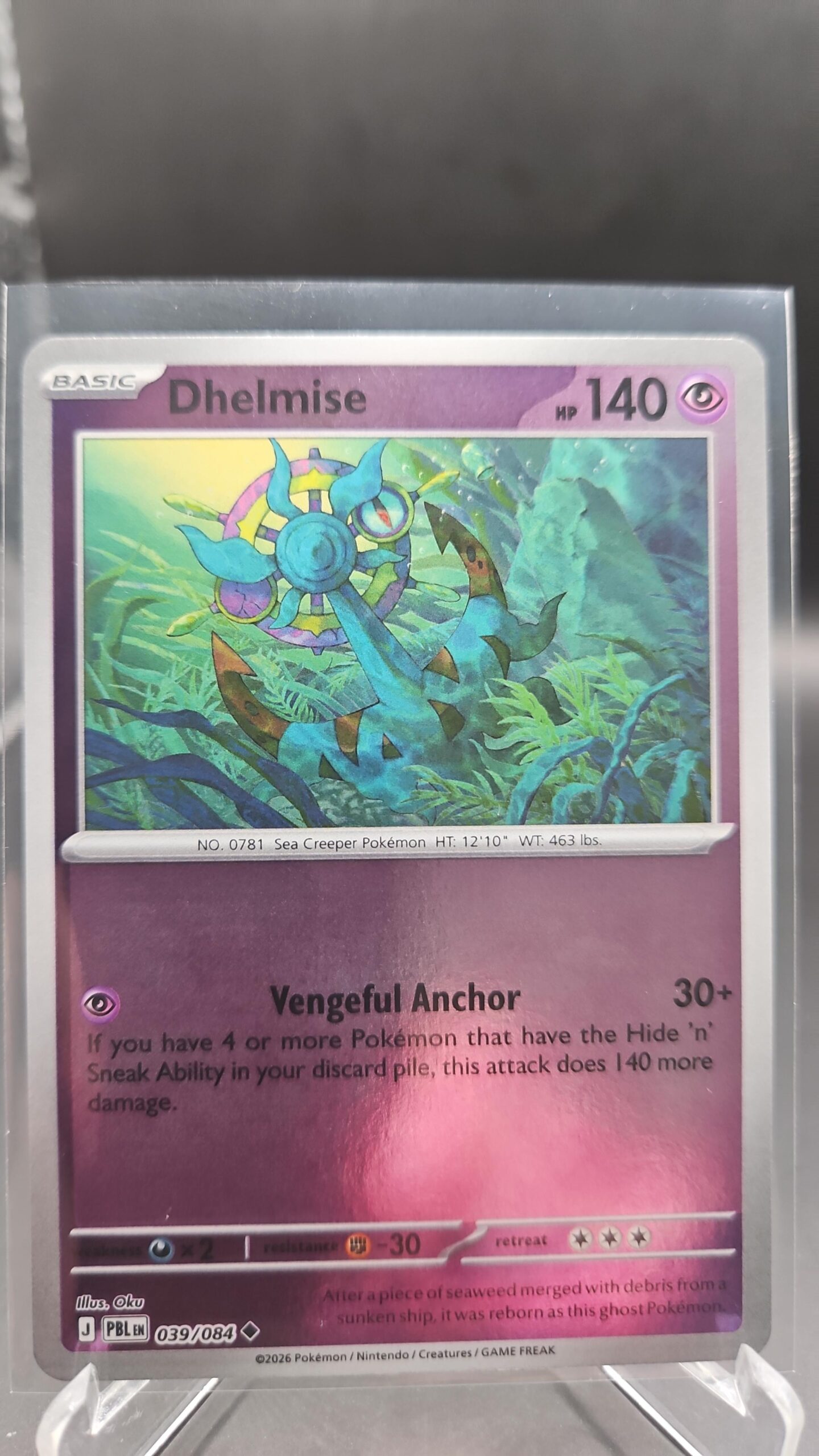 Dhelmise 039/084 Reverse Holo Pokémon card from Pitch Black ME05 in Near Mint condition.