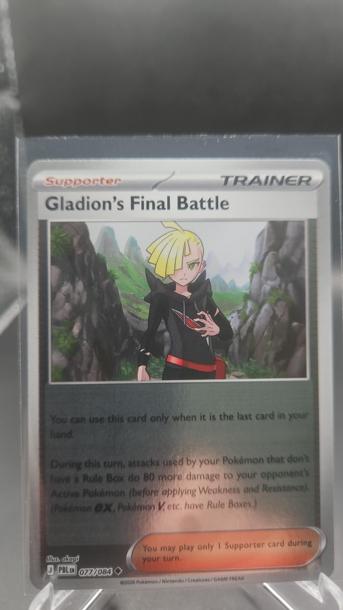 Gladion’s Final Battle 077/084 Reverse Holo Pokémon card from the Mega Evolution Era Pitch Black ME05 set in Near Mint condition.