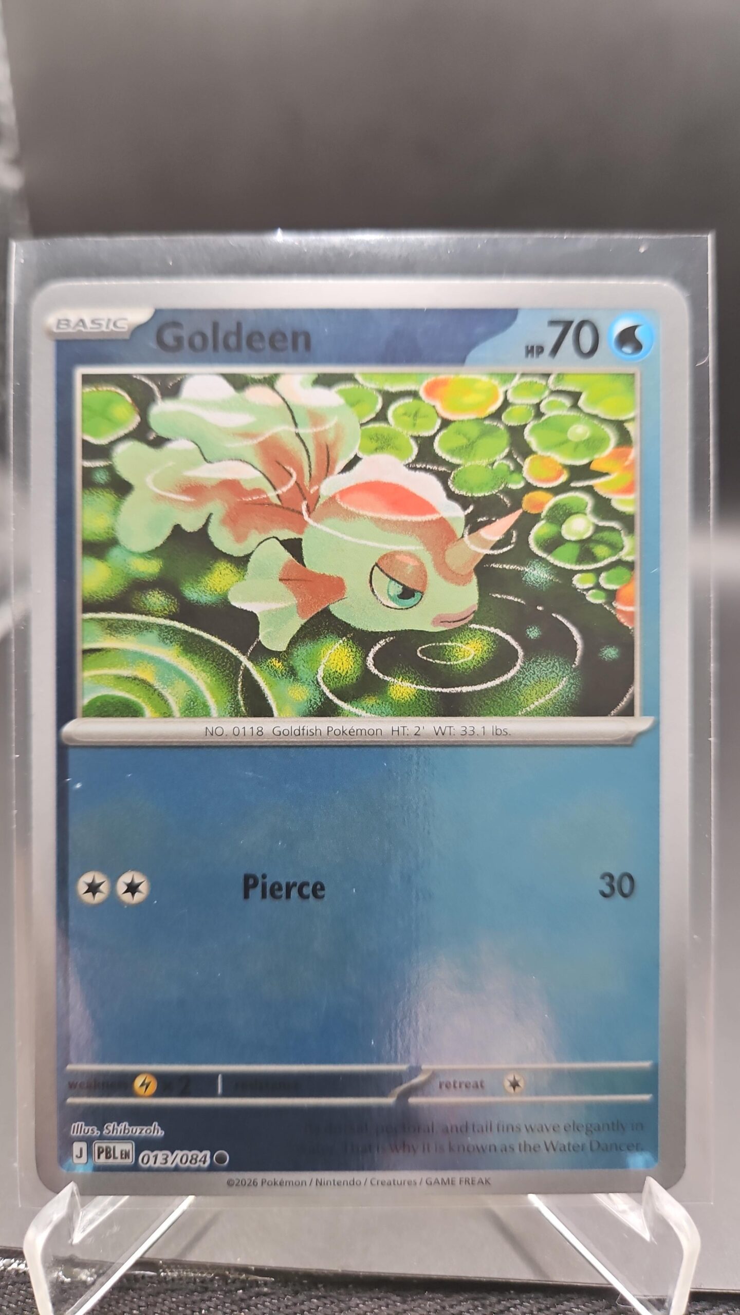 Goldeen 013/084 Reverse Holo Pokémon card from Pitch Black ME05 in Near Mint condition.