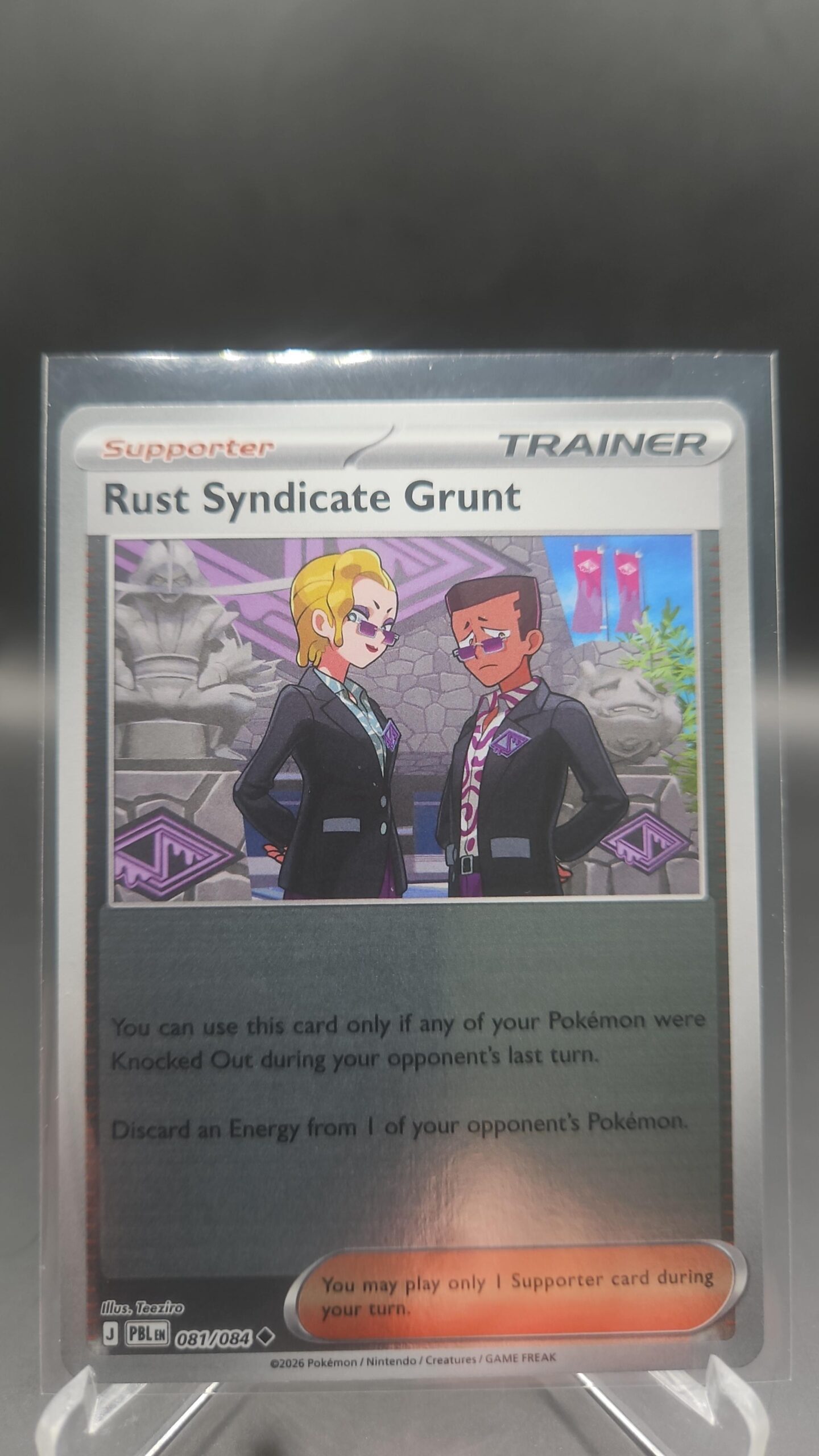 Rust Syndicate Grunt 081/084 Reverse Holo Pokémon card from Pitch Black ME05 in Near Mint condition.