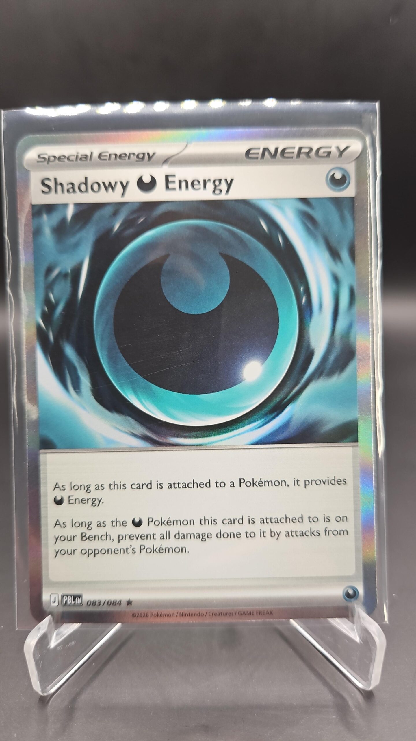 Shadowy Darkness Energy 083/084 Rare Holo Pokémon card from Pitch Black ME05 in Near Mint condition.