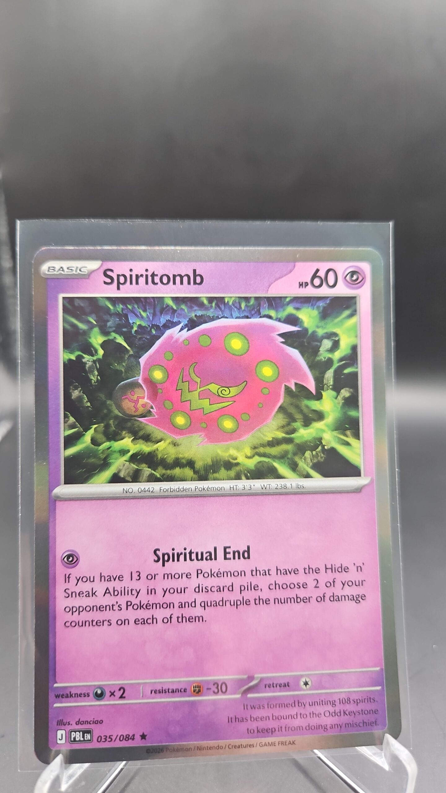 Spiritomb 035/084 Rare Holo Pokémon card from Pitch Black ME05 in Near Mint condition.