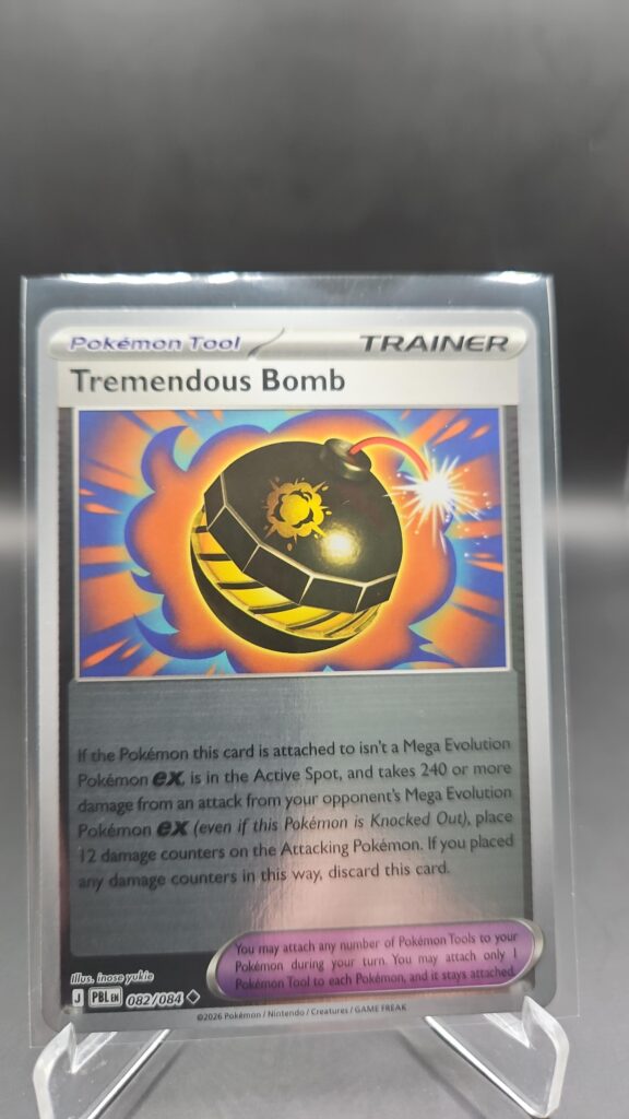 Tremendous Bomb 082/084 Reverse Holo Pokémon card from Pitch Black ME05 in Near Mint condition.