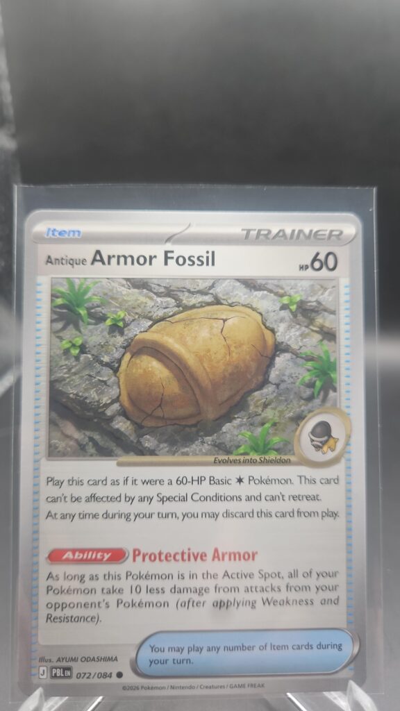 Antique Armor Fossil 072/084 Base Item Pokémon card from the Mega Evolution Era Pitch Black ME05 set in Near Mint condition.