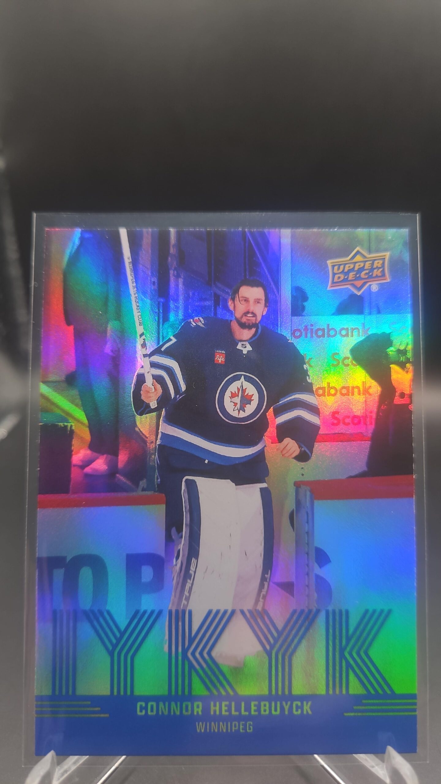 Connor Hellebuyck IYKYK #IYKYK‑8 card from 2025‑26 Upper Deck Series 2 in Near Mint condition.