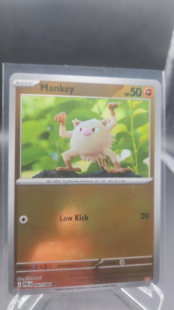Mankey 042/084 Reverse Holo Pokémon card from the Mega Evolution Era Pitch Black ME05 set in Near Mint condition.