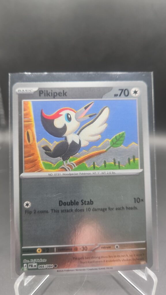 Pikipek 066/084 Reverse Holo Pokémon card from the Mega Evolution Era Pitch Black ME05 set in Near Mint condition.