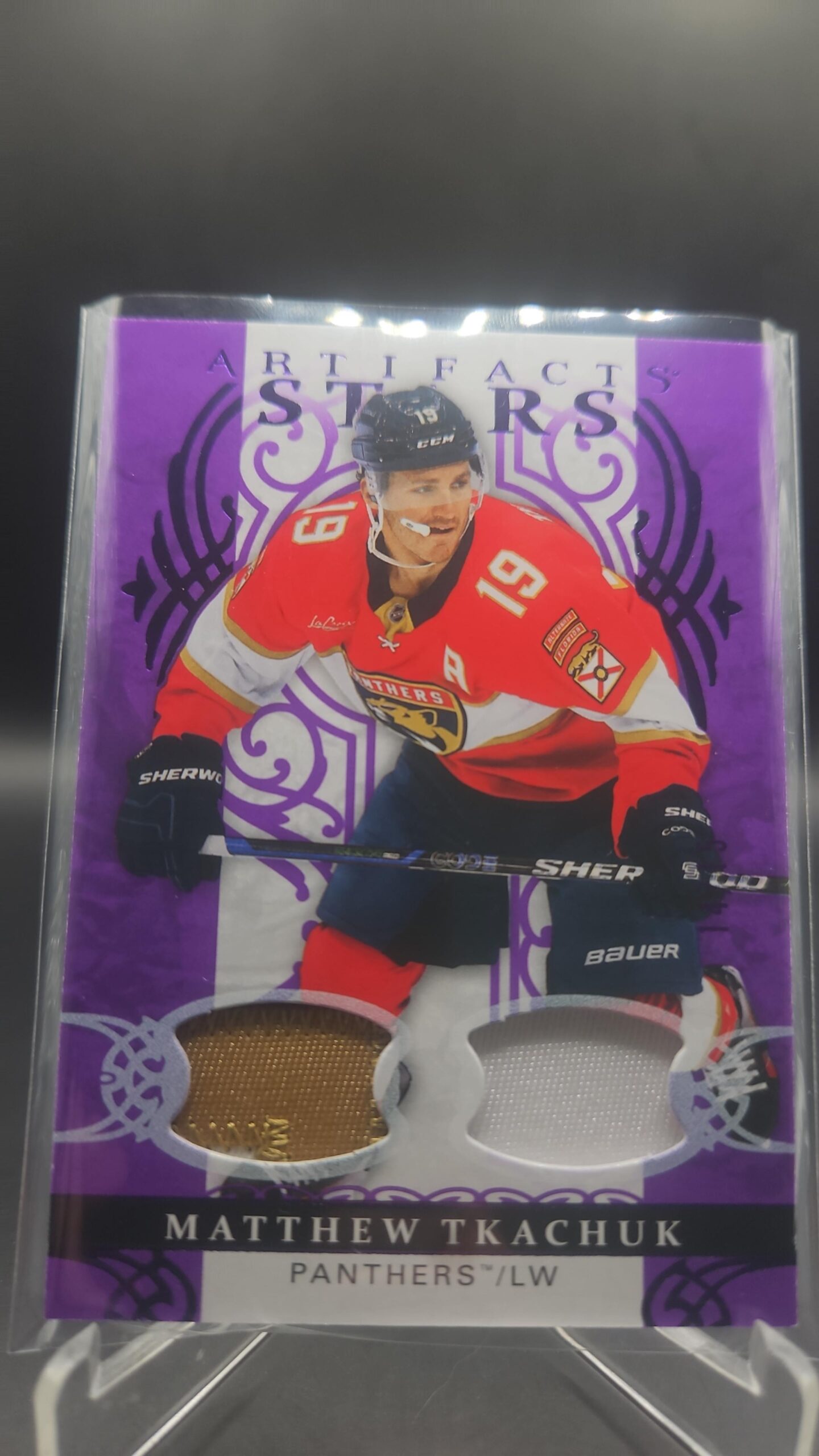 Matthew Tkachuk 2026‑27 Artifacts Stars Purple Material /15 with 3‑color patch. Title: Tkachuk Artifacts Purple /15 – 3‑Color Patch